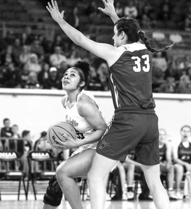 KHS SENIORS Allison Green (21 in left photo)and Rayland Garner (right photo) scored 11 points each in Tuesday’s 50-41 loss to Weatherford in the Class 4A state quarterfinals at State Fair Arena. Green scored all of her points in the first half and Garne Lady Jacket run ends at state