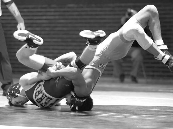 KINGFISHER’S Maliki Haynes worked from the predicament into top position during his 13-6 win over Perry’s Hayden Balderson during their 132-pound match last Tuesday. For more action photos from the dual, visit the KT&amp;FP Facebook Page. [KT&amp;FP S