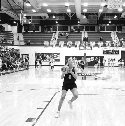 ADLEE FRIESEN sizes up this layup with time winding down Saturday night. Friesen sprung loose for the bucket, which clinched Kingfisher’s victory over Oologah. [Photo by Russell Stitt/www.stitt.smugmug.com]