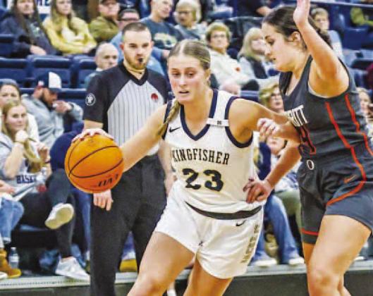 AS OF Tuesday, all six county schools are officially in basketball season. That includes Raegan Snider (23) and the Kingfisher Lady Jackets. For more on this week’s games, see Page 7. [Photo by Chris Simon/www.simon-sports-photos.smugmug.com]
