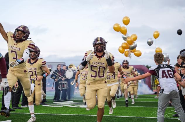 CASHION’S FOOTBALL team, including #50 Gavin Layton, run through the tunnel and onto the turf field at the new Maxon Field for the very first time. The Wildcats debuted their new home stadium last Friday in a Week 0 win over Hennessey. Article Image Alt Text
