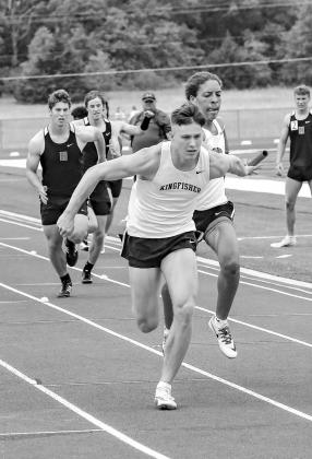 MATTHEW STONE takes the baton from Max Washington during a relay at the 4A regional meet last weekend. Stone qualified for state in four events and Washington in two as KHS took third place as a team. [Photo by Chris Simon/www.simon-sports-photos.smugmug. Stephenson, Stone grab 4 medals