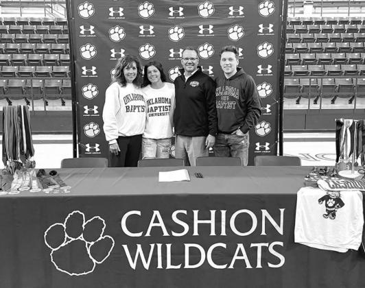 CASHION SENIOR Lauren Lamb, second from left, is pictured last Friday at a ceremony in which she signed to compete in track and field for Oklahoma Baptist University. She is pictured with her mother, Monica; father, Todd; and brother, Griffin. Lamb one da Lamb caps week with team title
