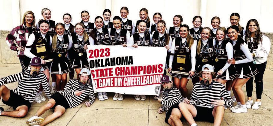 2 TROPHIES AND A BANNER - Cashion Game Day cheer state championship members show off their two newest trophies and banner. Team members are, from left: front row, flag boys Maxx Higdon, Cooper Frazee, Drew Westerhoff and Titus Davis; middle row, Landrie S TITLE TOWN