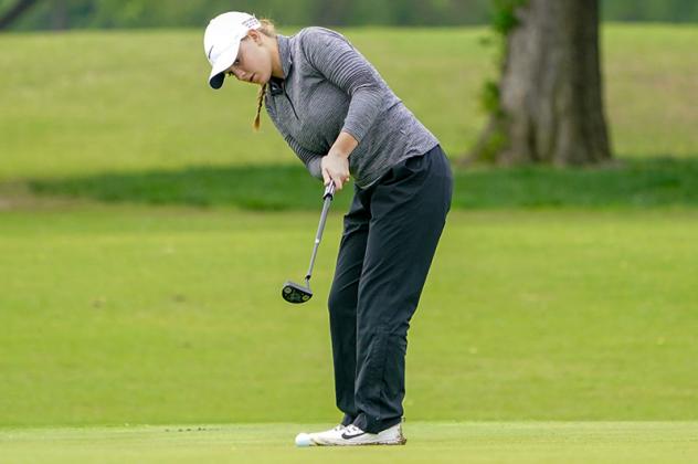MADDI KAMAS watches a putt during the Class 4A state golf tournament in Oklahoma City. The KHS sophomore had to settle for a state runner-up finish. [Photo by Russell Stitt/www.stitt.smugmug.com Article Image Alt Text