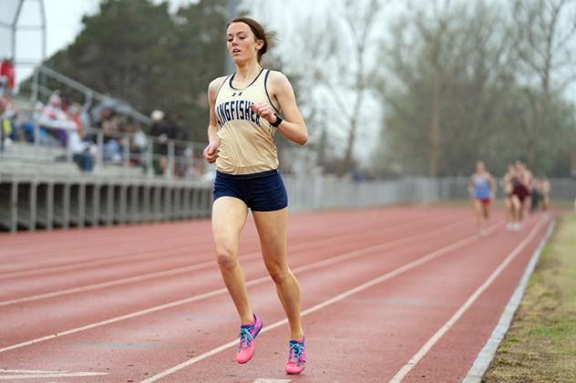 KHS SENIOR Madeline Loosen leads the pack in a meet earlier this season. Loosen did much the same last Friday when she won the 800 and mile runs and also anchored the gold medal winning 3,200 meter relay team at the Kingfisher High School Invitational. Article Image Alt Text