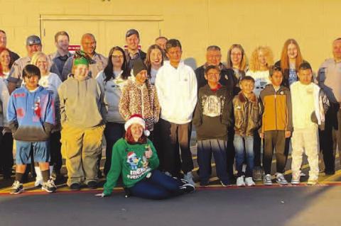 COPS - AND KIDS - SHOPPING – Members of the Kingfisher Police Department and their significant others spent several hours Saturday morning shopping with local children at Walmart as part of the Shop With a Cop program. After buying presents for the enti