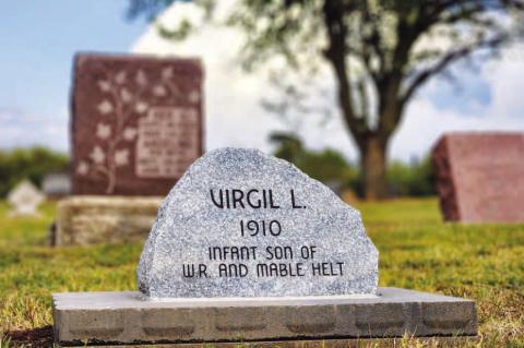HERE LIES....Pictured is the newly-placed headstone for Virgil L. Helt at Grimes Cemetery east of Kingfi sher. Virgil lived for only four hours and his grave was unmarked for more than 100 years. His niece, Evelyn Helt-George, spent more than 30 years fi nding out more information about him, fi nding his burial plot and recently had a service to honor him. [KT&FP Photo by Twila Adams]