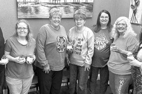 Pictured holding their gifts are, from left: Cowan Neal, Amy Tollison, Wittrock, Bengs, Britton, Butcher and Von Pops. [Photo provided]