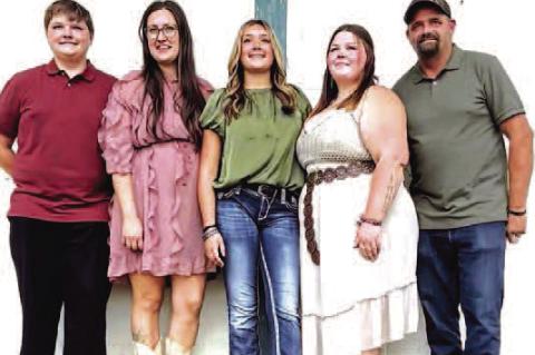 DEVASTATING FIRE – A home belonging to an Okarche family was destroyed by fire last week, leaving a large part of it reduced to ashes and rubble. Family members include, from left, Corbin Smith, Hope Smith, Lycan Smith, Cortney Tabor and JD Smith. Not p
