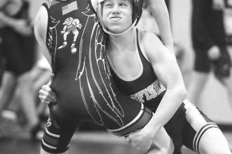 KINGFISHER’S Steel Snodgrass makes a takedown attempt during one of his Friday matches at the Western Conference Wrestling Tournament. Snodgrass placed fifth at 112 pounds in the junior high division. [KT&amp;FP Staff Photo]