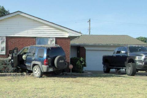 Fleeing car crashes into home