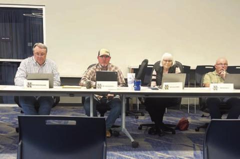 MONEY TALKS – Kingfisher Superintendent Andy Evans, far right, goes over the current budget situation with members of the board of education during Monday’s meeting. Board members are, from left, Brad Wittrock, Mike Copeland, Charles Walker, Dana Golb