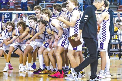 OKARCHE’S BOYS basketball team prepares to collect the gold ball after winning the 2025 Class A state championship, its second straight, last March. Many from that team will take the court in Tulsa this week at the 60th Tournament of Champions. [Photo b