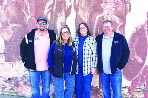 THE FIREWORKS (AND DRONE) GUYS – Jesse Williams, far left, and John Griffin, far right, of Precision Fireworks were in Kingfisher earlier this fall to look over the downtown area to plan for setting up the annual Kingfisher Christmas parade fireworks di