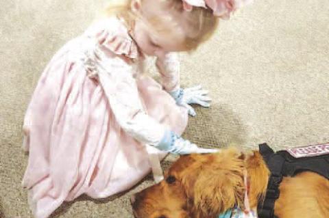 MARLEY AND BAILEY – Marley Cooper of Kingfisher pets Bailey, the Emmanuel Lutheran Church’s comfort dog. Marley is the daughter of Cammeron and Kari Cooper and granddaughter of Mark and Lynn Wendt. The church is hosting Bailey’s annual 5K and fun ru