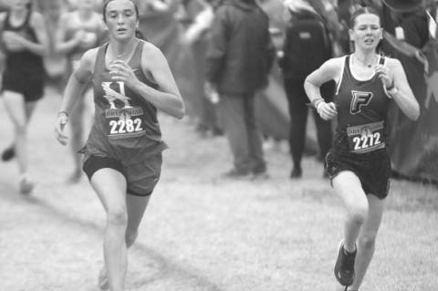 HENNESSEY’S Tayler Franklin, left, made up several places down the stretch of the Class 2A state cross country meet to finish 36th out of 135 competitors. [KT&FP Staff Photo]