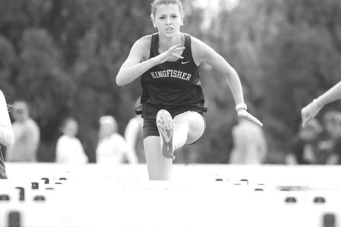 KHS JUNIOR Sofia Dudzinski clears a hurdle during the 100 meter event at last week’s Chisholm meet. Dudzinski placed fifth and KHS was second as a team. [KT&amp;FP Staff Photo]