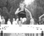 KHS JUNIOR Sofia Dudzinski clears a hurdle during the 100 meter event at last week’s Chisholm meet. Dudzinski placed fifth and KHS was second as a team. [KT&amp;FP Staff Photo]