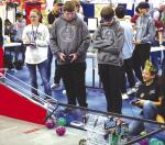 REGIONAL COMPETITION – Kingfisher’s Bob-Bots members (above) Will Finley and Raiden Clarke work together during one of the matches at the FTC regional held Saturday at the APB. The Bob-Bots qualified for state as did Okarche’s WarriorBots. Pictured 